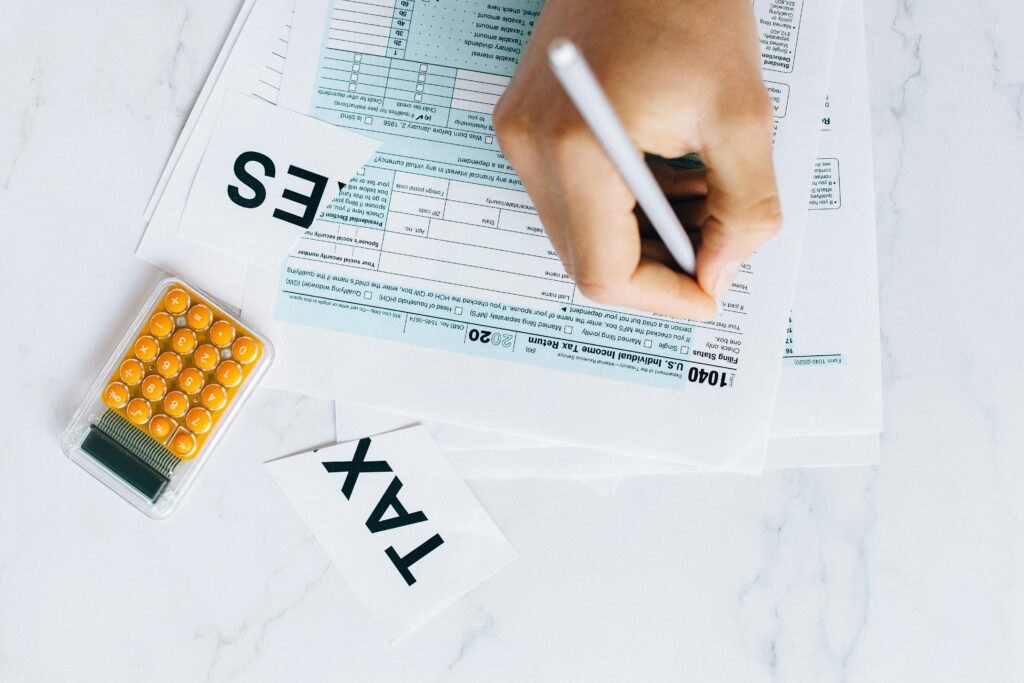 Someone filling out a tax related document
